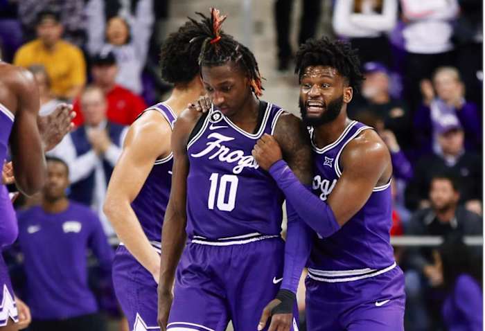 Mike Miles and Damion Baugh playing in a TCU basketball game.